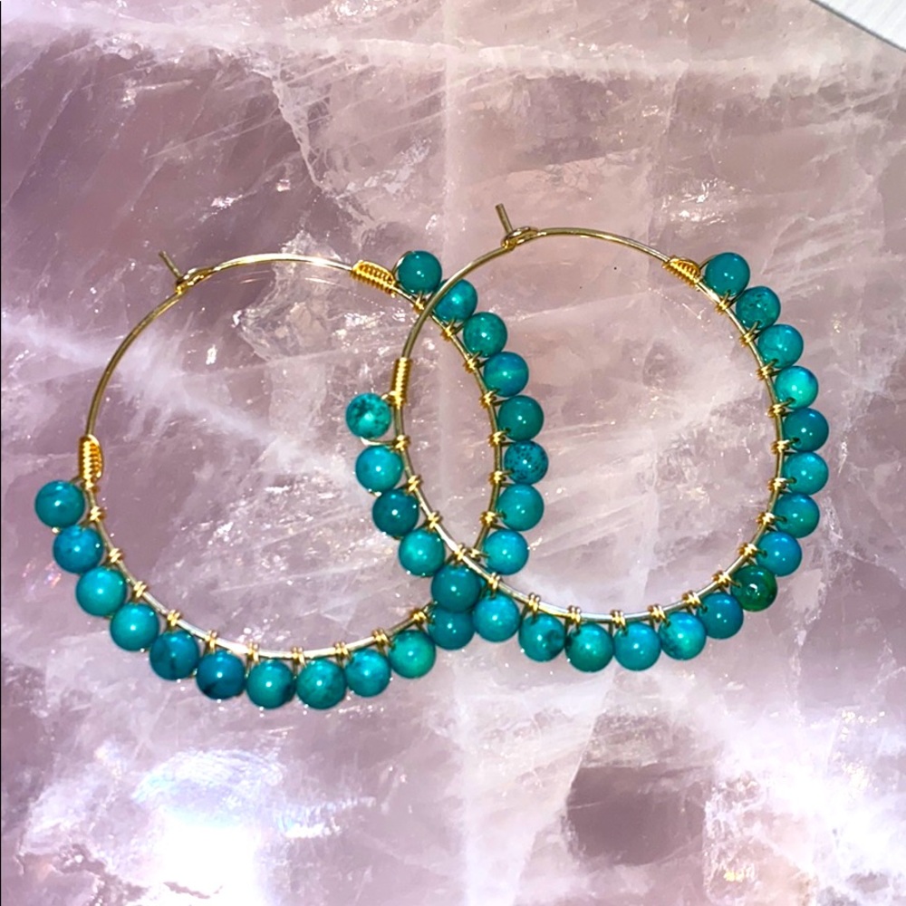 Genuine turquoise beaded gold hoop earrings.
